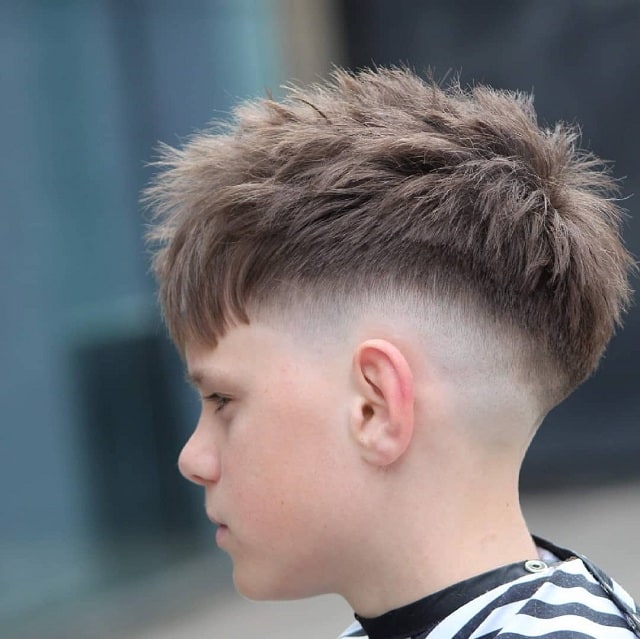 Kids fade haircut with messy hair