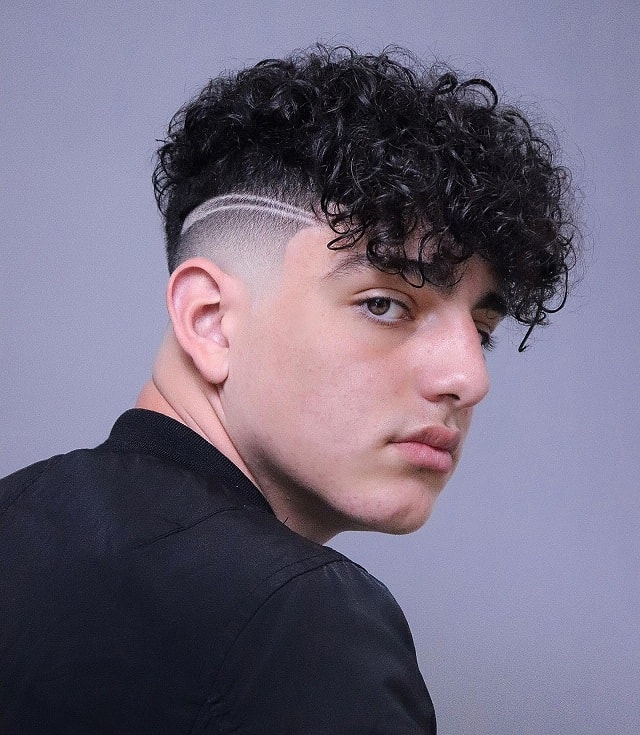 Curly fade with shaved line