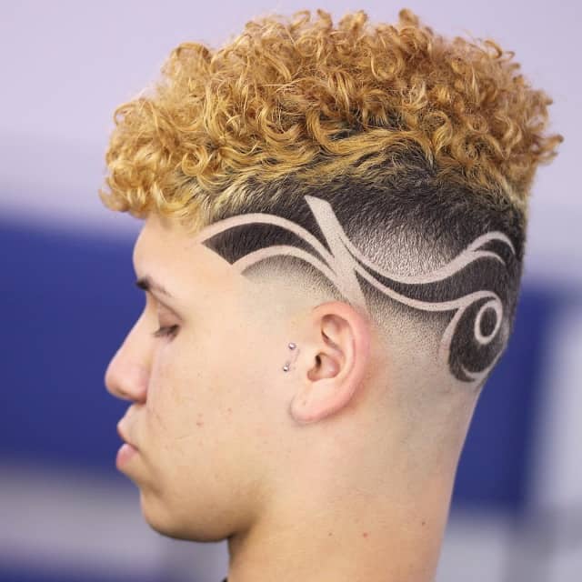 Curly fade with side design