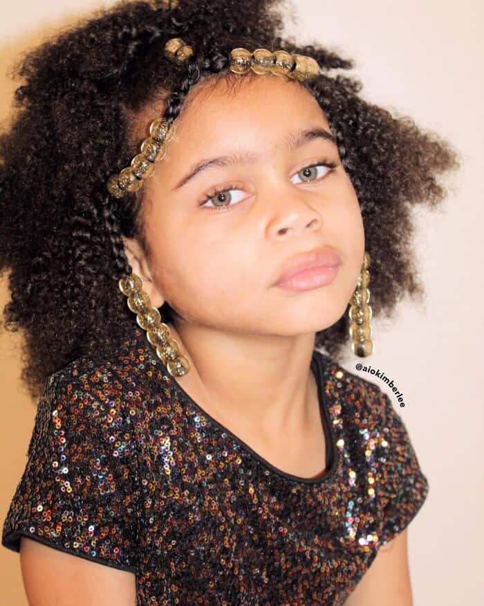 Little Girl With Curly Puff