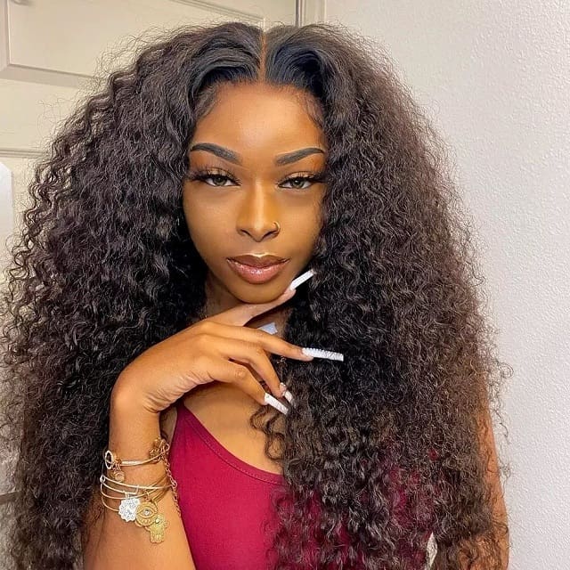 curly hair weave with middle part