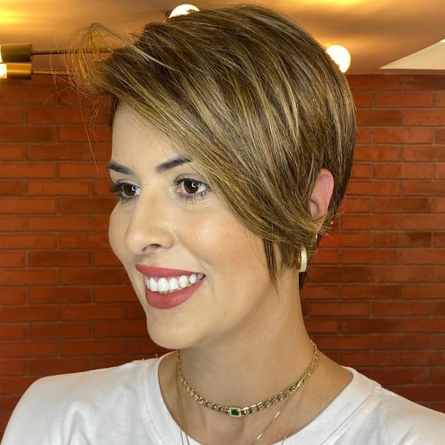 defined pixie cut with long side swept bangs